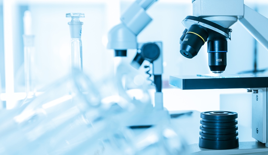 Microscope in Laboratory in light blue